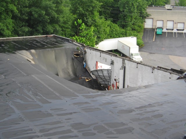 Building Collapse 6-28-2006.  Heavy rain and debris clogged roof drains caused this roof to fail.